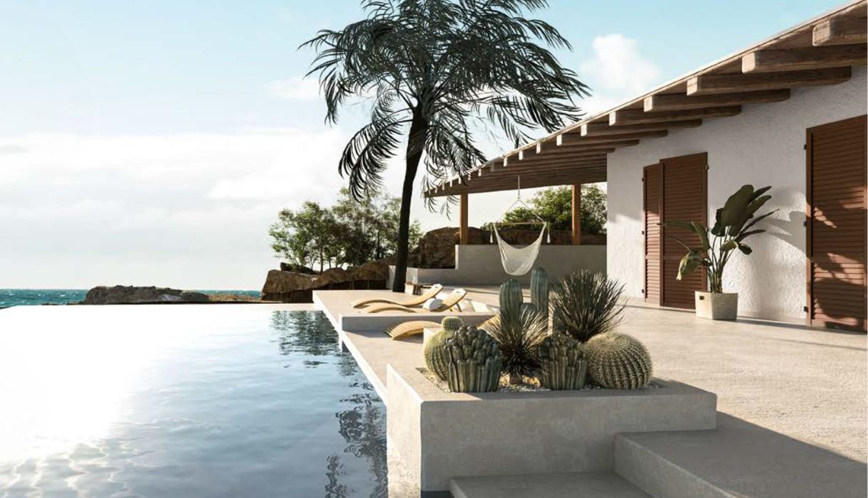 Villa mediterranea con serramenti e persiane in PVC effetto legno IsolCasa affacciata su una piscina