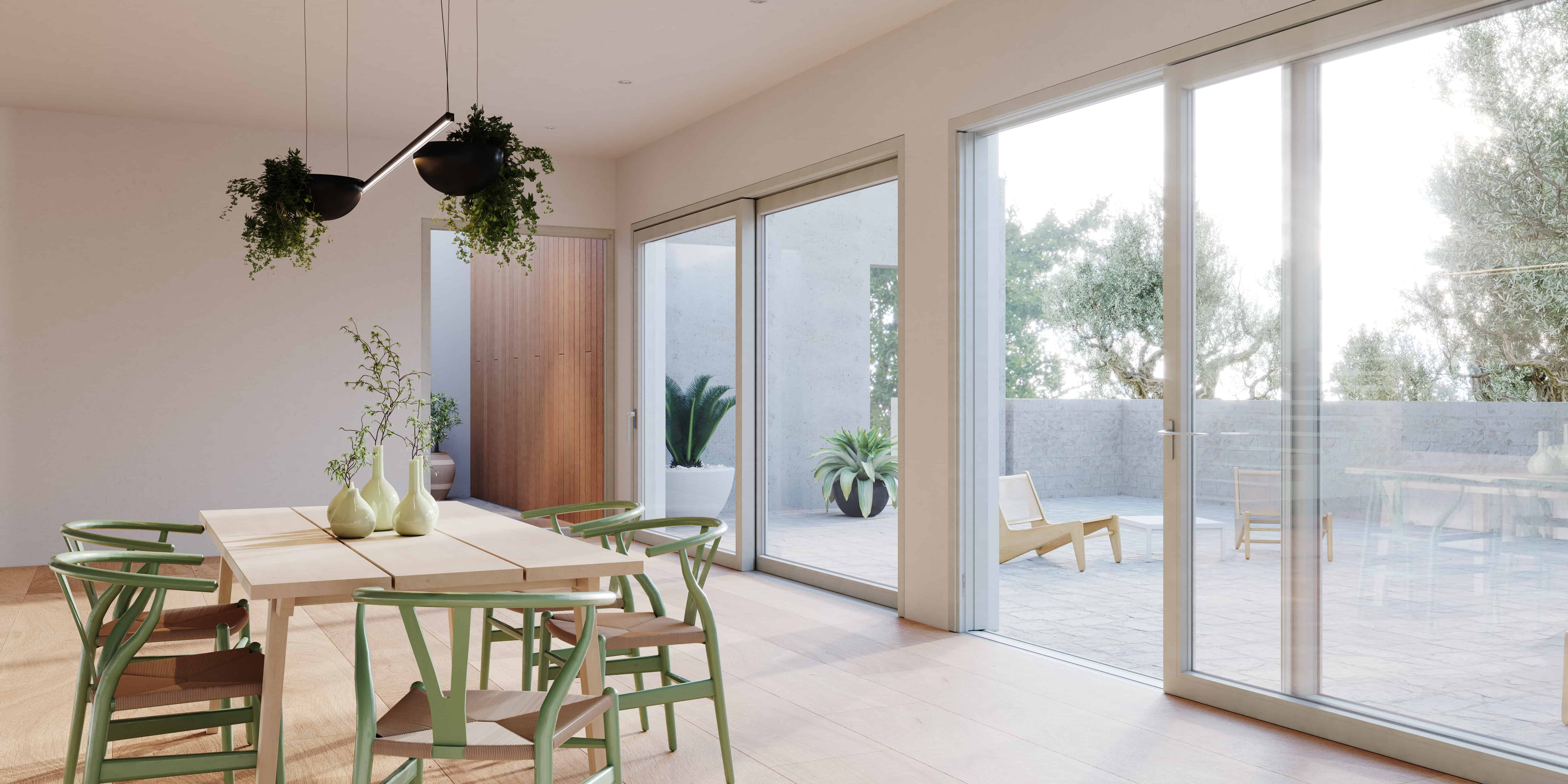 Scorrevole Nurith in PVC che si apre su un patio mediterraneo con ulivo, in una sala da pranzo minimale
